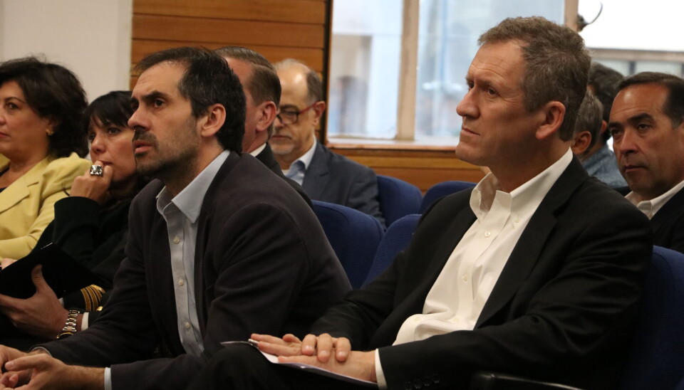 Los ministros Nicolás Grau y Juan Carlos Muñoz durante el evento en que se dio la partida al proceso participativo que convoca a la industria logística y portuaria.